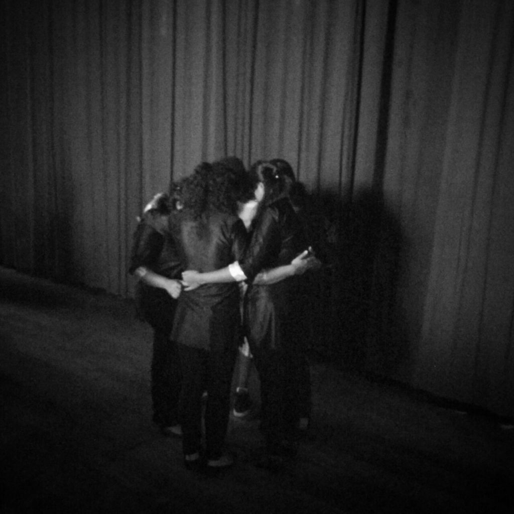 a group of people praying